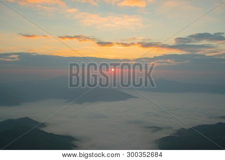 Beautiful Morning Sunrise Over Mountain And Fog.