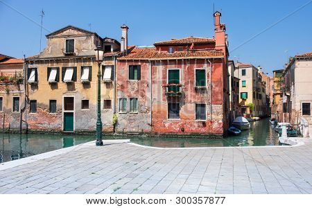 Old Houses And Waterways In Central Venice In Italy On A Bright Day