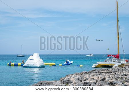 Montego Bay, Jamaica - March 20 2018: Tourists Enjoying Trampoline And Other Summer Water Activities
