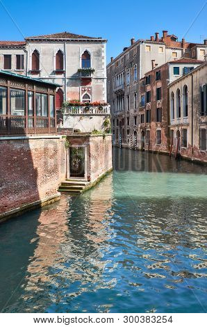 Old Houses And Waterways In Central Venice In Italy On A Bright Day