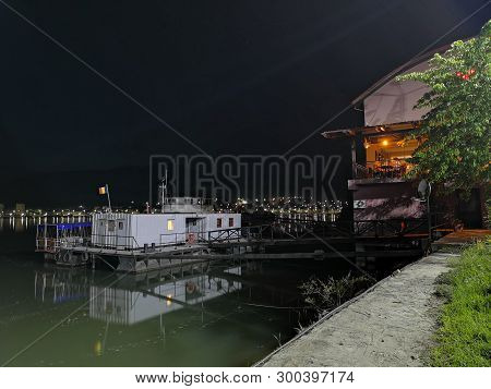 City Lights Reflection In The Water - Danube River - Orsova.
