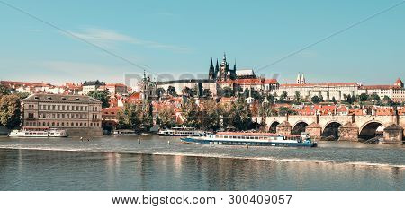 Prague Castle, Charles Bridge And Passenger Ships On Vltava River, Toned Image