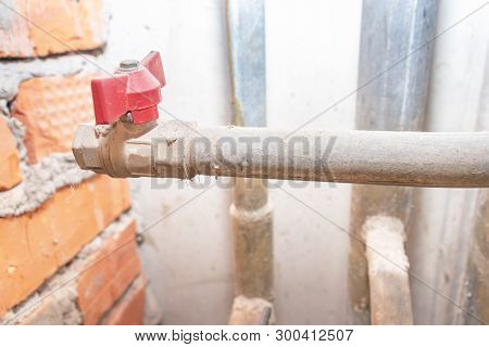 Red Water Valve On Old Metal Pipe Line
