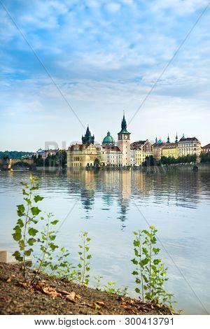 Historical Buildings And Charles Bridge In Prague From Across The River