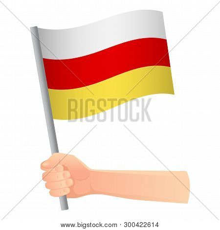 South Ossetia Flag In Hand. Patriotic Background. National Flag Of South Ossetia Vector Illustration