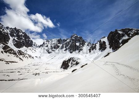 Snowy Sunlight Mountains With Footprints And Cloudy Blue Sky In Sunny Spring Day. Turkey, Kachkar Mo