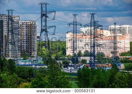 Industrial Landscape. Metal Supports Of The High-voltage Power Line In Front, Against The Background