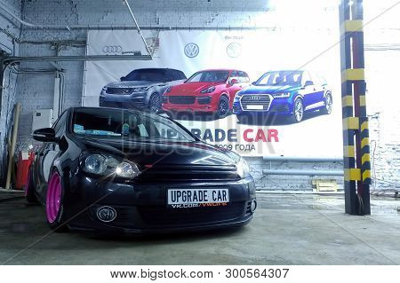 Moscow, Russia - May 08, 2019: A Black Tuned And Understated Volkswagen Golf 6 With Bright Pink Hand