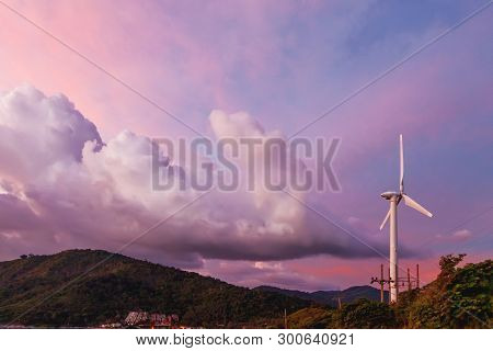 Gorgeous Sunset On Kata Beach View Point. Electric Wind Turbine On Pink Cloudscape Background. Phuke
