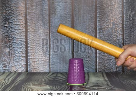 Plastic Trash And Human. Hand Breaking Plastic Cup As The Concept Of Plastic Rejection.