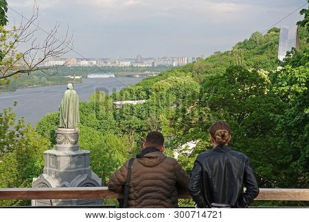 People On Vladimirskaya Gorka In Kiev Admire The View Of The City