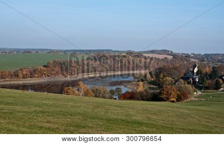Talsperre Pohl Water Reservoir With Church In Altensalz Village And Beautiful  Landscape Around Near