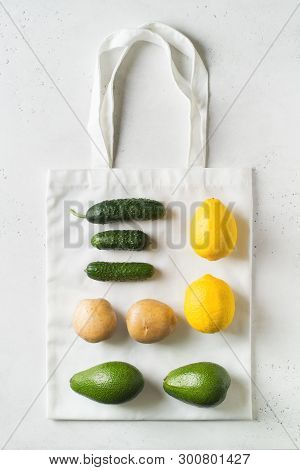 Zero Waste Concept. Textile Ecologiical Shopping Bags With Fruits And Vegetables On White Background