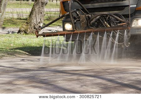 The Water Cart Waters Paths In The Park