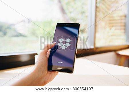 Chiang Mai, Thailand - Jan. 19,2019: Woman Holding Huawei With Dropbox On Screen. Dropbox Is A Servi