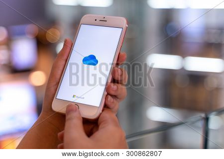 Chiang Mai, Thailand - May.10,2019: Woman Holding Apple Iphone 6s Rose Gold With Onedrive On Screen.
