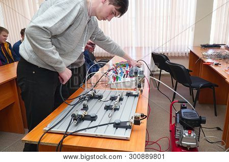 Chapaevsk, Samara Region, Russia - April 17, 2019: Students Connect Wires Control Panel With A Small