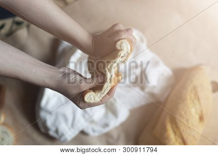 Food Concept. Hand Clicing A Bread. Cutting Bread. Top View. Free Space For Text. Copy Space
