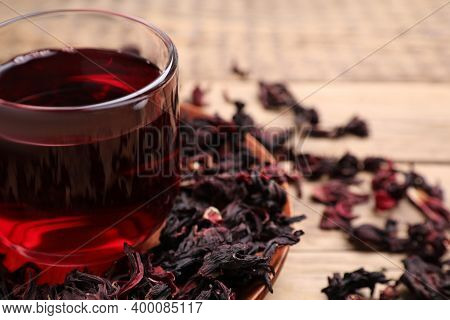 Fresh Hibiscus Tea On Wooden Table, Closeup