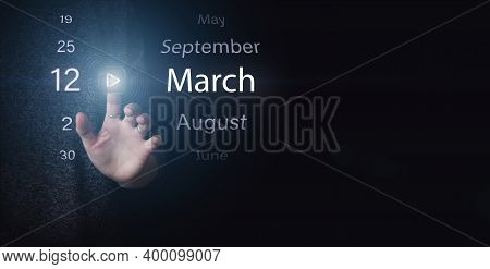 March 12nd. Day 12 Of Month, Calendar Date. Hand Click Luminous Icon Play And Date On Dark Blue Back