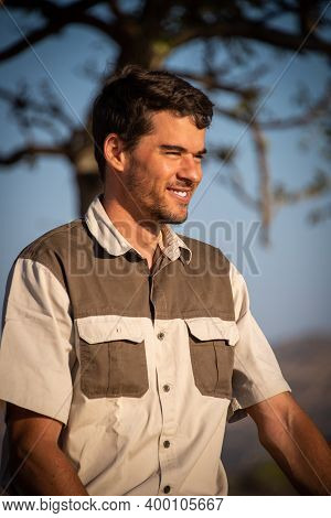 Close-up Of Safari Guide Smiling In Sunshine