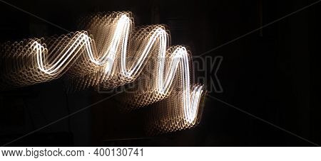 Neon Wave Light Abstract Flowing Through A Black Background