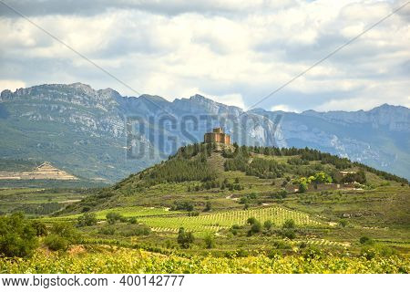 Vineyard Landscape With The Medieval Castle Of Davalillo On Top Of A Hill And The Sierra De Cantabri