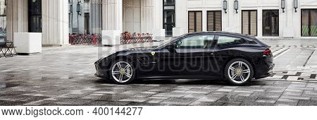 Warsaw, Poland - 13.04.2019: Ferrari Gtc4 Lusso In The Courtyard Of The Socialist Realist Building W
