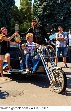 Kremenchug, Ukraine - September 22, 2018: Unknown People Rides Three Wheeled Motorcycle On A City Sq