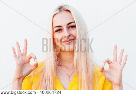 Cheerful Funny Cute Woman With Blonde Hair Gesturing Ok