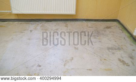 Flooring Works With Self-levelling Mortar. Primed Floor. Flooring Works With Self-levelling Mortar.