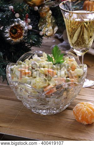 Champagne, Tangerines And Olivier Salad On The Festive Table