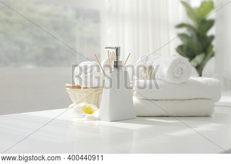 Soap Dispenser And Spa Towel ,roll Up Of White Towels On White Table With Copy Space,towels Studio S