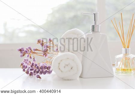 Soap Dispenser And Spa Towel ,roll Up Of White Towels On White Table With Copy Space,towels Studio S