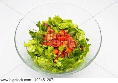 Fresh Raw Green Healthy Lettuce Salad In Glass Plate, Isolated On White Background