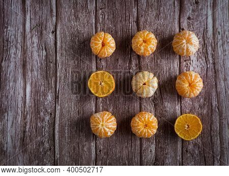Orange Fresh Mandarine On Brown Wooden Background