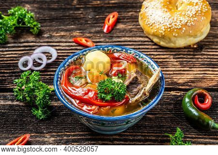 The Shurpa Soup In The Plate With Oriental Ornament, Uzbek Oriental Cuisine. Uzbek Food. Food Recipe