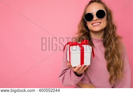 Shot Of Attractive Positive Smiling Young Blonde Woman Isolated Over Colourful Background Wall Weari