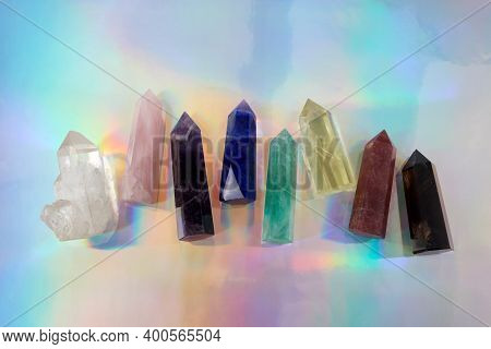 Healing Chakra Crystals On Halographic Background. Meditation, Reiki Or Spiritual Healing Background