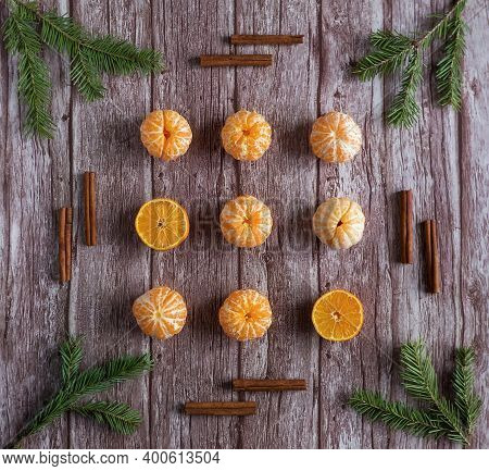 Orange Tangerine Branches Christmas Tree Cinnamon Sticks On Wooden Background