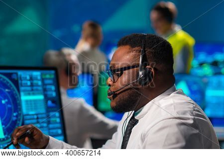 Workplace Of The Air Traffic Controllers In The Control Tower. Diverse Team Of Aircraft Control Offi