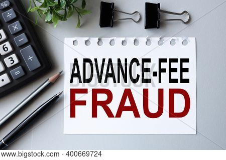Advance Fee Fraud, Text On White Paper On Gray Background