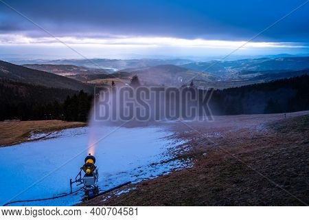 First Winter Snow Making. Snow Cannon At Evening Time. Rokytnice Nad Jizerou, Giant Mountains, Czech