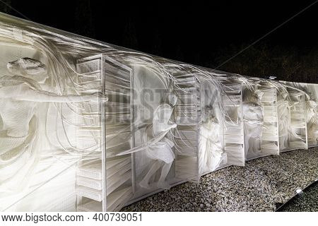 Fragment Of White Multi-figured Bas-relief Made Of Plastic Mesh By Artists Recycle Group. Art Compos