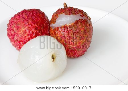 Fresh lechee on the white dish with white background