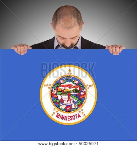 Smiling Businessman Holding A Big Card, Flag Of Minnesota