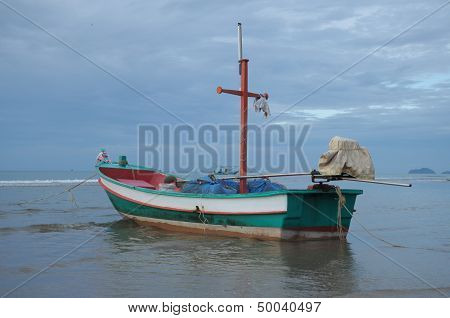Fishing Boat On The Shore At Low Tide.