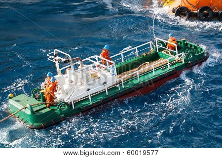 boatman working on deck supply boat, crews operation on installation boat, heavy job in offshore