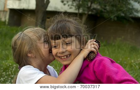 Two Girlfriends Are Whispering