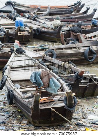 Boats Along A Polluted Seaside In Myanmar
